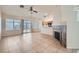 Open living room with light-colored walls, tile floors, and a fireplace at 914 Calico Brook Dr, Henderson, NV 89002