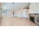 Living room featuring tile floors, light-colored walls, a modern fireplace, and white doors at 914 Calico Brook Dr, Henderson, NV 89002