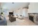 Open living room with light-colored walls, tile floors, a fireplace, and furniture at 914 Calico Brook Dr, Henderson, NV 89002