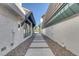 Side yard features stone pathway and gravel landscaping at 916 Vegas Valley Dr, Las Vegas, NV 89109