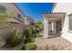 Backyard featuring desert landscaping, a covered patio, and a peaceful outdoor dining area at 9233 Far Side Ave, Las Vegas, NV 89143