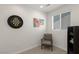 Bright bedroom with a chair, artwork, and a window at 9233 Far Side Ave, Las Vegas, NV 89143