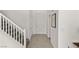 Bright and spacious entryway featuring tile floors, a staircase, and neutral decor at 9233 Far Side Ave, Las Vegas, NV 89143
