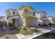 Charming two-story home with a desert landscape, a two-car garage and a warm, inviting front entrance at 9233 Far Side Ave, Las Vegas, NV 89143
