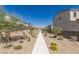 A well-maintained neighborhood with modern homes and desert landscaping, enhanced by a clear blue sky at 9233 Far Side Ave, Las Vegas, NV 89143