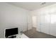 Minimalist office with sliding door closet and a large computer monitor at 9233 Far Side Ave, Las Vegas, NV 89143
