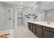 A spacious bathroom with a walk-in shower, soaking tub, and dual sinks at 965 Nevada State Dr # 36102, Henderson, NV 89002