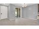 Bright dining area with sliding glass doors and tile floors adjacent to the kitchen at 965 Nevada State Dr # 36102, Henderson, NV 89002