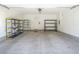 Clean garage with built-in shelving units and concrete flooring, perfect for storage and organization at 965 Nevada State Dr # 36102, Henderson, NV 89002