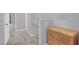 Upstairs hallway that features neutral carpet, doors, and wicker storage at 965 Nevada State Dr # 36102, Henderson, NV 89002