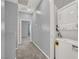 Upstairs hallway with neutral carpet and laundry machines at 965 Nevada State Dr # 36102, Henderson, NV 89002