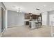 Bright kitchen featuring modern appliances, an island with bar stools, and stylish lighting at 965 Nevada State Dr # 36102, Henderson, NV 89002