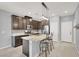 Modern kitchen featuring stainless steel appliances, an island with bar seating, and ample counter space at 965 Nevada State Dr # 36102, Henderson, NV 89002