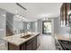 Kitchen featuring modern appliances, large island, and an open floor plan to the living area at 965 Nevada State Dr # 36102, Henderson, NV 89002