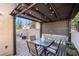 Cozy patio with modern gazebo, perfect for outdoor dining and relaxation in a private setting at 10435 Meadow Village St, Las Vegas, NV 89183