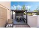 Inviting backyard patio with a covered dining area, perfect for outdoor entertaining and relaxation at 10435 Meadow Village St, Las Vegas, NV 89183
