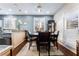 Cozy dining area featuring a dark wood table set, window with white shutters, and pendant lighting at 10435 Meadow Village St, Las Vegas, NV 89183