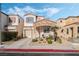 Charming two-story home with stone accents, desert landscaping, and an attached garage at 10435 Meadow Village St, Las Vegas, NV 89183