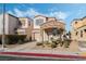 Charming two-story home with stone accents, desert landscaping, and an attached garage at 10435 Meadow Village St, Las Vegas, NV 89183