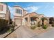 Charming two-story home with stone accents, desert landscaping, and an attached garage at 10435 Meadow Village St, Las Vegas, NV 89183