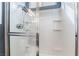 Modern shower stall features a glass enclosure, rainfall shower head, and built-in shelving at 10435 Meadow Village St, Las Vegas, NV 89183