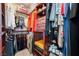 Walk-in closet is equipped with custom shelving, drawers, and hanging rods for optimal storage at 10435 Meadow Village St, Las Vegas, NV 89183