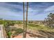 Expansive view from the balcony overlooking lush greenery, mature trees, and neighborhood rooftops at 138 Wentworth Dr, Henderson, NV 89074