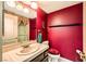 Cozy bathroom featuring a sink with decorative faucet, toilet with cushioned seat, and walk in shower at 138 Wentworth Dr, Henderson, NV 89074
