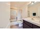 Bathroom featuring a shower over tub with glass doors, a toilet, and vanity sink at 138 Wentworth Dr, Henderson, NV 89074