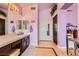 This bathroom boasts double sinks, tiled floors, a full mirror, and a water closet at 138 Wentworth Dr, Henderson, NV 89074