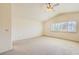 Large bedroom with a vaulted ceiling, a big window, and plush carpet at 138 Wentworth Dr, Henderson, NV 89074