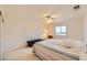 Bright bedroom with a large window, ceiling fan, and comfortable carpet at 138 Wentworth Dr, Henderson, NV 89074