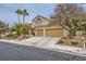 Inviting two-story home with a well-maintained front yard, desert landscaping, and a two-car garage at 138 Wentworth Dr, Henderson, NV 89074