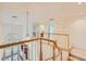 Foyer with wood banister and staircase with large window providing natural light at 138 Wentworth Dr, Henderson, NV 89074