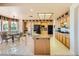 Well-equipped kitchen with an island, black appliances, tile floors, and a breakfast nook at 138 Wentworth Dr, Henderson, NV 89074