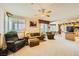 Bright living area with large windows, plush seating, and seamless connection to the kitchen at 138 Wentworth Dr, Henderson, NV 89074