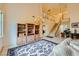 Bright living room featuring high ceilings, a chandelier, and a view of the staircase at 138 Wentworth Dr, Henderson, NV 89074