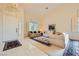 Bright living room with tile flooring, large windows, and comfortable seating creating an inviting space at 138 Wentworth Dr, Henderson, NV 89074