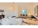 Spacious living room with tile flooring, arched windows, and comfortable seating, creating a warm atmosphere at 138 Wentworth Dr, Henderson, NV 89074