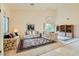Elegant living room featuring high ceilings, tile floors, large windows, and comfortable seating at 138 Wentworth Dr, Henderson, NV 89074