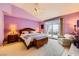 Spacious bedroom featuring vaulted ceilings, private balcony access, and calming views at 138 Wentworth Dr, Henderson, NV 89074