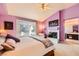 Large bedroom with patio access, decorative fireplace, and en-suite bathroom at 138 Wentworth Dr, Henderson, NV 89074