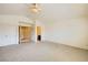 Spacious main bedroom features neutral carpet, fan lighting, and ensuite bathroom entrance at 138 Wentworth Dr, Henderson, NV 89074