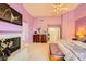 Bright bedroom with fireplace, walk-in closet, and adjacent bathroom with dual vanities at 138 Wentworth Dr, Henderson, NV 89074