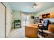 Inviting office space with sliding glass doors to a balcony, built in shelves and ample desk space at 138 Wentworth Dr, Henderson, NV 89074