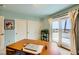 Inviting office space with sliding glass doors to a balcony, built in shelves and ample desk space at 138 Wentworth Dr, Henderson, NV 89074