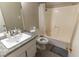 Bathroom featuring a vanity with a granite countertop and a shower-tub combo at 1467 Hialeah Dr # D, Las Vegas, NV 89119