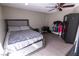 Comfortable bedroom with a ceiling fan, a comfortable bed, and plenty of closet space at 1467 Hialeah Dr # D, Las Vegas, NV 89119