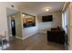 A modern living room with wood floor and a view of the kitchen through the pass through at 1467 Hialeah Dr # D, Las Vegas, NV 89119
