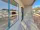 Private balcony with sliding glass doors offers natural light and beautiful views of the community at 1575 W Warm Springs Rd # 1111, Henderson, NV 89014